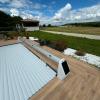 Volet roulant de piscine sur terrasse bois