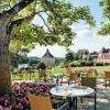 brasserie le chai au Château des Vigiers, restaurant tradictionnel en Dordogne près de Bergerac et Saint-Emilion. Restaurant avec magnifique vue