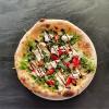 Nos délicieuses pizzas cuites au feu de bois
