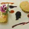 Foie gras au rhum mi- cuit au torchon, confit d'agrume, perles de figue et de truffe noire, toast