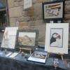 Marché de paimpol: tableaux faits avec du sable .