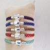 Bracelet cuir tressé.
 Taille: du 17 cm au 23 cm 4.50€.