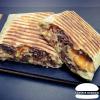 Tacos – Le Montagnard : Tacos – Le Montagnard !!! Tacos fait maison avec des ingrédients de qualité : tortillas de blé 30cm,  steak frais du boucher de 150g, cheddar rouge, bacon, raclette, oignons, sauce gruyère.
