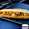 Le Panini Poulet Curry : fait maison avec des ingrédients de qualité : Poulet curry, cheddar rouge, oignons, sauce curry.
