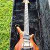 Guitare électrique multidiapason, plus d'une dizaine d'essences différentes, acastillage et filets cuivre et laiton de ma fabrication, 280 h de travail.