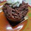 torche aux marrons , caissette chocolat, meringue , caramel , vermicelle de marrons et chantilly