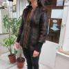 c 'est une veste en fourrure a était rallonger avec des bord côte noir et transformé le col par retouches vêtements tissus & cuir
 