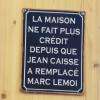 pancarte au dessus de la caisse du magasin