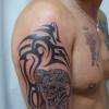 Tribal avec tête de mort réalisé par Serge Tattoo Evolution Perpignan . Tatoueur depuis 1984