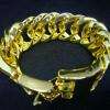 Gros bracelet fantaisie en métal doré