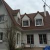 Installation de nouvelles tuiles sur toiture 4 pans